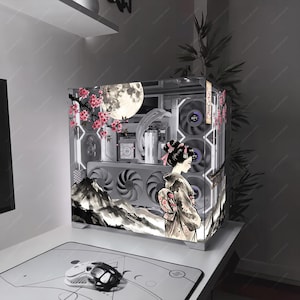 May include: A computer case featuring a printed graphic of a person in a kimono standing before a mountain landscape, a full moon, and cherry blossom branches. The interior contains cooling fans and hardware components visible through the glass panel.