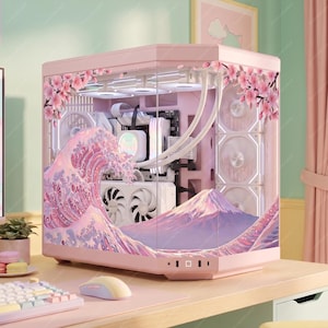 May include: A pink computer case with a glass side panel, featuring a wave and mountain design in shades of pink and purple. Cherry blossom accents adorn the top and side. The case houses internal components with white fans.