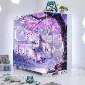 May include: A white computer case with a glass panel depicting a fantasy scene of a woman on a swing under a cherry blossom tree. The case is decorated with anime figurines and a mouse.