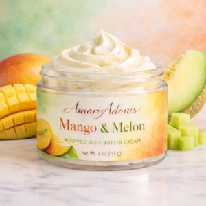 May include: A jar of Amari Adonis Mango & Melon Whipped Body Butter Cream. The jar is surrounded by mango and melon slices. The label reads "Net Wt. 4 oz (113 g)". The cream is white and swirled on top.