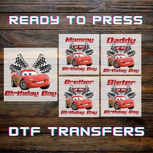 May include: DTF transfers featuring Lightning McQueen from the Cars movie. The designs include "Birthday Boy", "Mommy of the Birthday Boy", "Daddy of the Birthday Boy", "Brother of the Birthday Boy", and "Sister of the Birthday Boy". The text "READY TO PRESS" and "DTF TRANSFERS" are also visible.