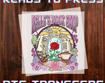 May include: DTF transfer with the text "READY TO PRESS" and "DTF TRANSFERS". The design features "BELLE'S BOOK SHOP", a rose in a glass dome, a teacup, and the words "Tale as old as Time".
