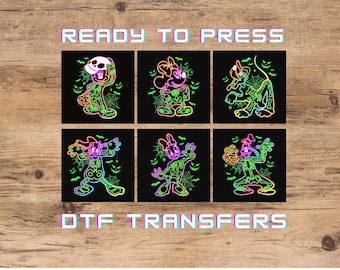 May include: Six black square DTF transfers featuring neon-colored skeleton versions of cartoon characters. The designs include spiderwebs, bats, and jack-o'-lantern faces. The text READY TO PRESS and DTF TRANSFERS appears in a glitch-style font.
