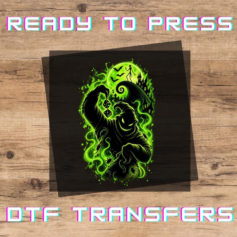 May include: A DTF transfer sheet featuring a graphic of a black silhouette character holding dice, surrounded by glowing neon green smoke, spiders, a crescent moon, and a haunted house. The text READY TO PRESS and DTF TRANSFERS is visible.