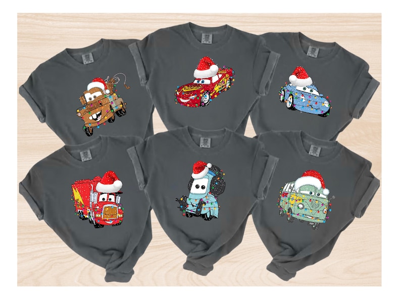 A collage of six t-shirts featuring cartoon cars and trucks with Santa hats on them.