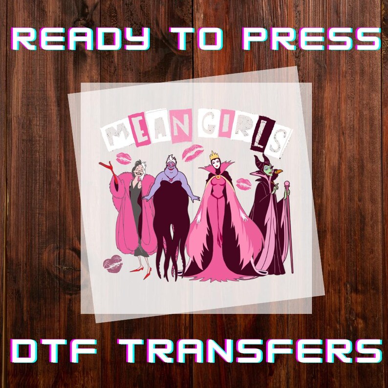 May include: DTF transfer with the text "READY TO PRESS" and "DTF TRANSFERS". The design features the words "MEAN GIRLS" and illustrations of Disney villains in pink and purple, with lipstick kiss marks.