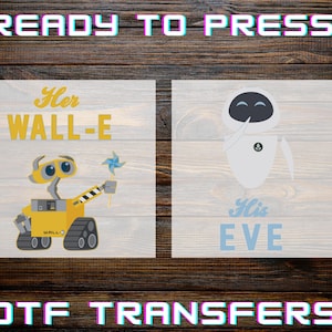 May include: Two DTF transfer designs featuring characters from the movie Wall-E. One design shows Wall-E with a pinwheel and the text "Her WALL-E". The other design shows Eve with the text "His EVE". The words "READY TO PRESS" and "DTF TRANSFERS" are also displayed.
