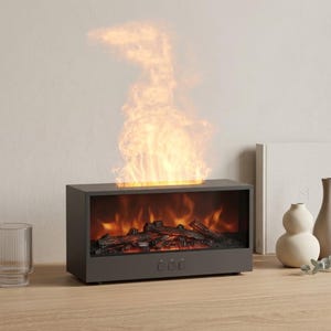 May include: A dark gray electric fireplace with a realistic flame effect. The rectangular unit features a glowing firebox with faux logs and three control buttons. The flames rise above the unit, creating a warm ambiance. Decorative vases and a glass are on the wooden surface.