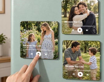 May include: Three square refrigerator magnets featuring photographic prints of people in outdoor settings. Each magnet displays a music player interface overlay with the text Because You Live by Jesse McCartney, a progress bar, and playback icons.