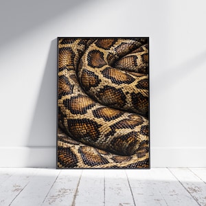 May include: A framed print featuring a close-up of a snake's coiled body. The snake's skin displays a pattern of brown and tan scales, creating a textured appearance. The artwork is set against a white wall and a wooden floor.