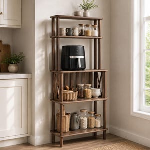 May include: A tall, dark wood kitchen shelving unit with four tiers. The top shelf holds mugs and glass jars. The second shelf features a black air fryer. The third shelf contains a woven basket and glass jars. The bottom shelf holds a woven basket, a gray pitcher, and glass jars.