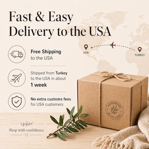 May include: A brown cardboard box tied with twine, featuring a circular stamp that reads Handmade With Care and includes a leaf illustration. Next to the box is a small green olive branch and a textured beige fabric, set against a light background.