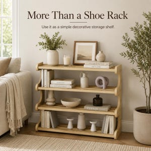 May include: A four-tier light wood storage shelf with curved side supports. The text "More Than a Shoe Rack" and "Use it as a simple decorative storage shelf" appears above. The shelves hold books, vases, a bowl, and decorative objects.