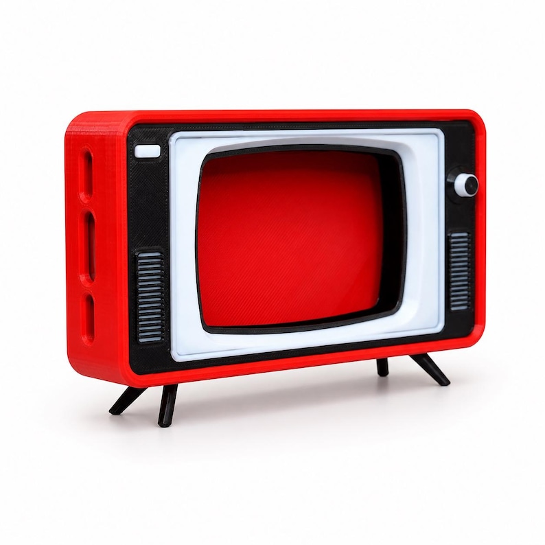 May include: A retro-style television set featuring a bright red outer casing, a white screen frame, and a black front panel. The device includes a small white power button, a circular control knob, and two vertical speaker grilles on the front.