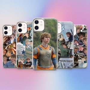 May include: A collection of five phone cases featuring images of a young man. The cases have a clear, glossy finish. Some cases have collages of photos, while others feature a single image of the young man in a costume. The cases are designed for a smartphone.