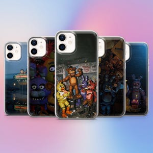 May include: Five clear phone cases with different designs featuring characters from a video game. The designs include a restaurant scene with text, and various character illustrations in shades of brown, purple, red, and blue.