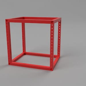 May include: A bright red, open-frame cube structure constructed from square-profile bars. Each of the four vertical corner posts features a series of evenly spaced, circular mounting holes running along the entire length of the frame.