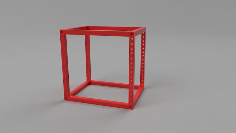 May include: A bright red, open-frame cube structure constructed from square-profile bars. Each of the four vertical corner posts features a series of evenly spaced, circular mounting holes running along the entire length of the frame.