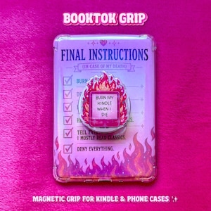 May include: A magnetic phone grip featuring a pink and orange flame design with the text 'BURN MY KINDLE WHEN I DIE' centred on a rectangular backing card. The card displays a checklist titled 'FINAL INSTRUCTIONS (IN CASE OF MY DEATH)'.
