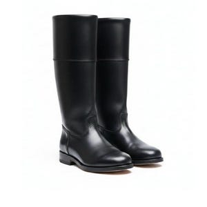 May include: A pair of black leather riding boots. The boots have a smooth, polished finish and a classic design, with a flat sole and a high shaft that reaches the knee. The boots are displayed against a white background.