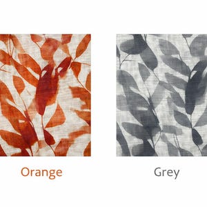 May include: Two fabric swatches with leaf patterns. One features orange leaves on a cream background, labeled "Orange." The other displays grey leaves on a cream background, labeled "Grey."