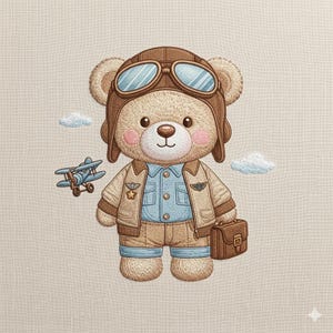 May include: Embroidered image of a teddy bear dressed as a pilot, wearing a brown aviator helmet and jacket. The bear is holding a brown briefcase and standing next to a blue aeroplane and two white clouds. The bear has pink cheeks.