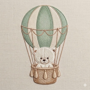 May include: Embroidered design of a teddy bear in a hot air balloon. The balloon is green and white, with a woven basket. The teddy bear is white with a brown nose and eyes. The background is a light beige fabric.