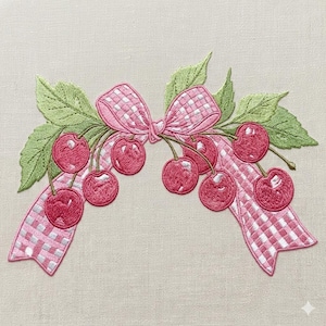 May include: Embroidered patch featuring a cluster of cherries with green leaves and a pink gingham bow. The cherries are a vibrant red, and the bow has a classic checkered pattern. The leaves are a soft green, creating a charming, decorative design.