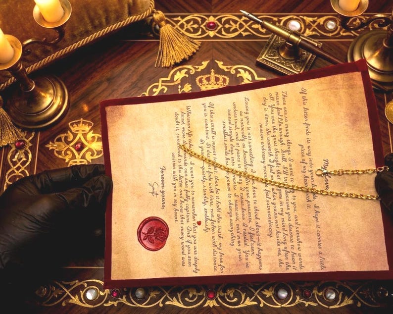 May include: A vintage-style parchment letter with a red wax rose seal, featuring handwritten-style text and a delicate gold-tone chain resting across the paper. The document is framed by a dark red border and held against a dark wooden desk surface.