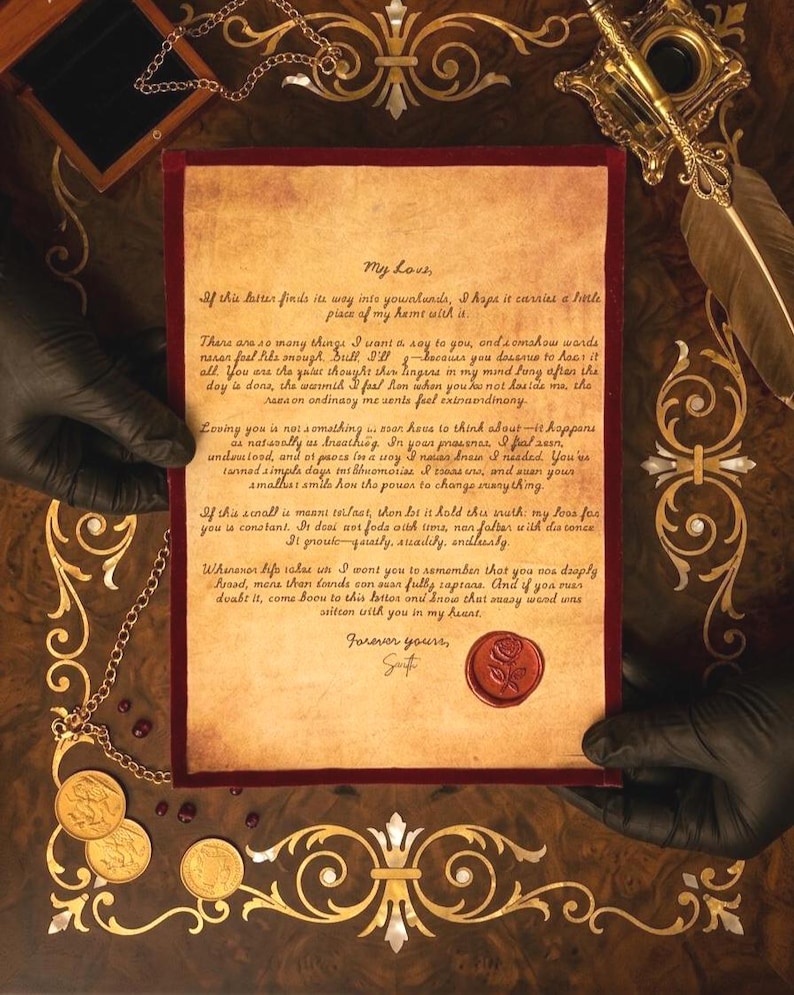 May include: A parchment letter with handwritten cursive text and a red wax seal featuring a rose design. The letter is bordered by a dark red velvet frame. The text begins with My Love and ends with Forever yours, with a signature below the wax seal.