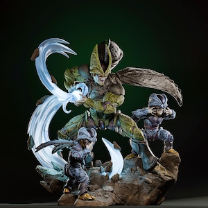 Puede incluir: Figura detallada de un personaje de la serie Dragon Ball Z. La figura central es una criatura insectoide grande, verde y marrón, con dos figuras más pequeñas en colores similares. Las figuras están posadas sobre una base rocosa con efectos de energía azul.