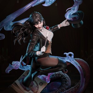 May include: A detailed statue of a female magician in a classic outfit, including a black top hat, a black jacket, and fishnet stockings. She holds a wand and smiles, with flowing purple energy around her. The statue is on a base with an octopus.