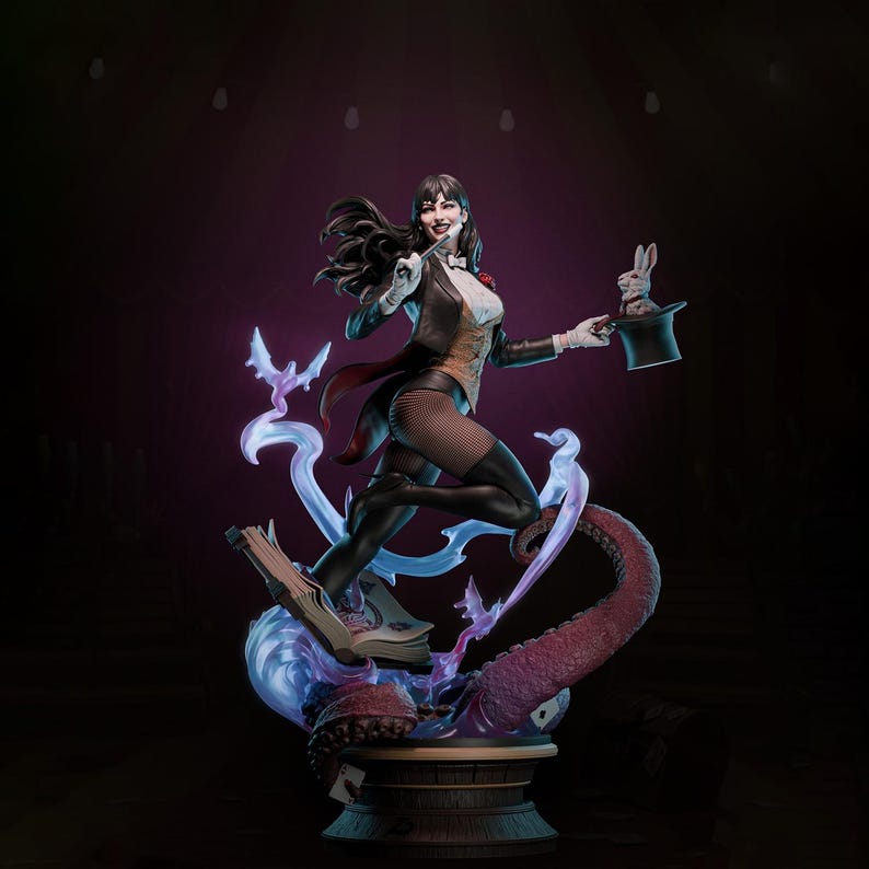May include: A detailed statue of a female magician in a classic outfit, holding a top hat with a rabbit. The figure is posed dynamically, with a flowing cape and intricate details. The base features a book, tentacles, and magical effects.