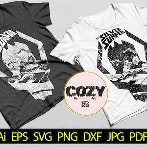 May include: Two t-shirts, one black and one white, each featuring a graphic of the Silver Surfer. The design includes the text "THE SILVER SURFER" and an illustration of the character. A pink circle with "COZY De Art ESTD 2025" is in the center.