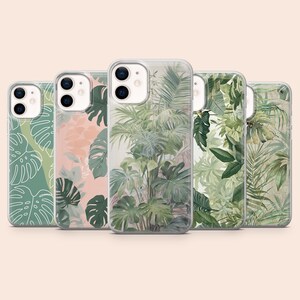 May include: Five clear smartphone cases arranged in a row, each featuring a unique botanical design. The patterns include white line-art monstera leaves on green, dark green foliage on a soft pink background, and various lush green tropical palm leaf prints.