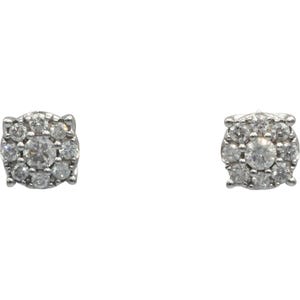 May include: A pair of silver-toned stud earrings. Each earring features a cluster of small, round, clear gemstones surrounding a larger central gemstone. The earrings have a square shape.