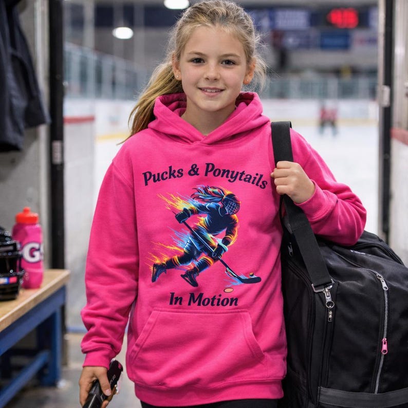Female Hockey Shirt Rainbow Design Hockey Girl Apparel Team Wear Sport Fashion Athletic Gear Hockey Player Silhouette Graphic Ponytail Style Game Day Outfit Sports Fan Clothing Colorful Pattern Women Athletes Representation Ice Hockey