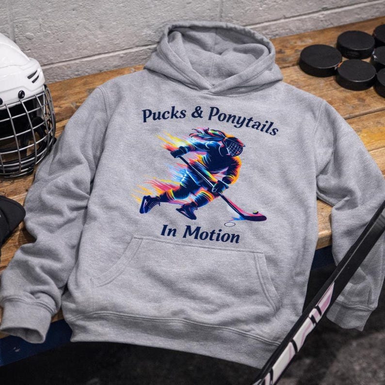 Sport Fashion Hockey Shirt Rainbow Design Female Player Apparel Team Wear Collection Athletic Gear Statement Hockey Girl Representation Ponytail Player Silhouette Graphic Colorful Pattern Women Sports Clothing Ice Hockey Enthusiast Gift