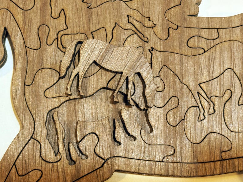Laser cut walnut plywood horse puzzle with intricate horse-shaped pieces, reusable storage bag, care instructions, and solution guide for horse lovers.