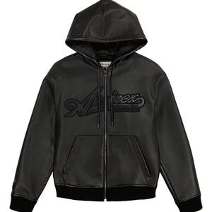 May include: Black leather zip-up hoodie with a drawstring hood and a black ribbed hem and cuffs. The word "Aviirex" is embroidered across the chest in a stylized font. The jacket has two front pockets.