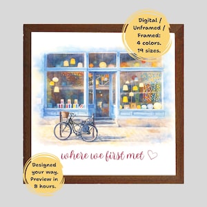 May include: Watercolor print of a shop with a blue facade, a bicycle, and the text "where we first met." The print is available in 4 colors and 19 sizes, digital, unframed, or framed. The image is in a brown frame.