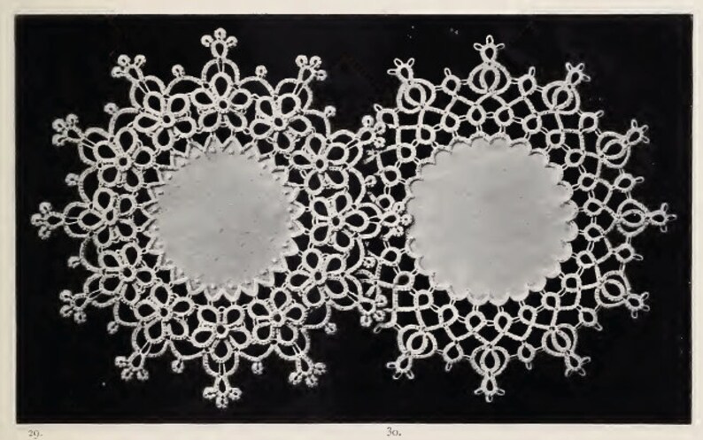 May include: Two white crocheted doilies with a circular design. The doilies have a delicate floral pattern and are set against a black background.
