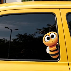 May include: A vinyl decal of a cartoon bee with large eyes, a yellow and black striped body, and small wings, applied to the dark tinted window of a yellow car. The bee character is positioned as if peeking from the edge of the window frame.