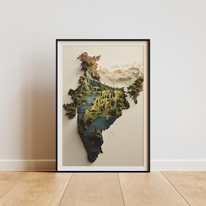 May include: A framed art print showing a 3D map of India, highlighting its varied terrain. The artwork features mountains, forests, and rivers, with a natural colour palette. The print is in a black frame, displayed on a white wall, and set on a wooden floor.