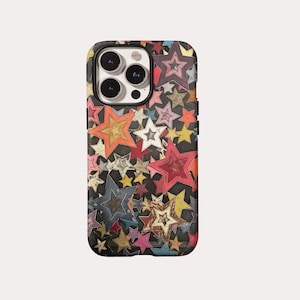 May include: A smartphone case featuring a black background covered in a dense pattern of multi-colored stars in various sizes and shades, including red, orange, yellow, blue, and white, with a cutout for a triple-lens camera system.