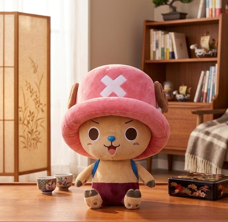May include: A plush toy of a cartoon character with a pink hat featuring a white cross, brown antlers, and large, round eyes. The character has a tan body, blue straps, and maroon shorts. The toy is a collectible item.