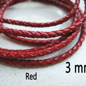 May include: Red braided leather cord, 3 mm thick.