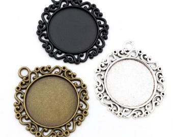 May include: Three round metal pendant trays with ornate filigree designs. The trays are black, silver, and bronze. Each tray has a circular glass insert.