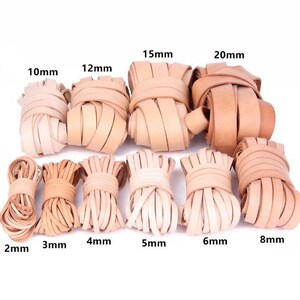 May include: A collection of natural-colored leather strips in various widths, ranging from 2mm to 20mm. The image displays bundles of leather strips, each labeled with its width in millimeters, suitable for crafting and leatherwork projects.