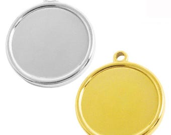 May include: Two round pendant trays, one silver-colored and one gold-colored. Each has a circular recessed area for inserting a design, with a small loop at the top for attaching to a chain or cord. These are ideal for DIY jewelry making.